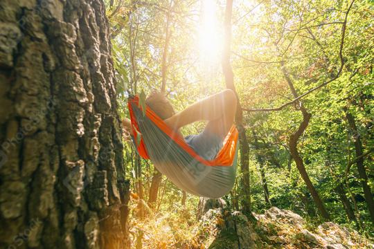 backpacker relaxing in the hammock in the forest  : Stock Photo or Stock Video Download rcfotostock photos, images and assets rcfotostock | RC Photo Stock.: