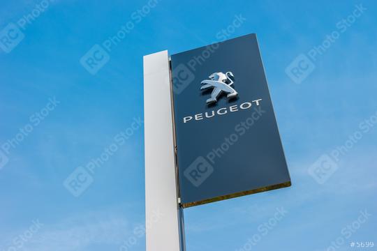 BAESWEILER, GERMANY MARCH, 2017: Peugeot dealership sign against blue sky. Peugeot is a French automobile manufacturer and part of Groupe PSA.  : Stock Photo or Stock Video Download rcfotostock photos, images and assets rcfotostock | RC Photo Stock.: