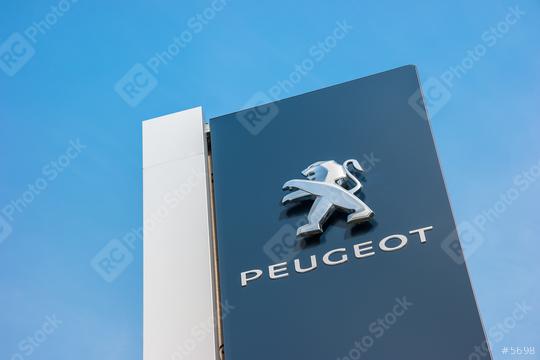 BAESWEILER, GERMANY MARCH, 2017: Peugeot dealership sign closeup against blue sky. Peugeot is a French automobile manufacturer and part of Groupe PSA.  : Stock Photo or Stock Video Download rcfotostock photos, images and assets rcfotostock | RC Photo Stock.: