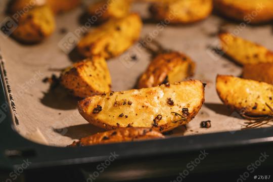 Baked potato wedges on baking tray -  homemade organic vegetable vegan vegetarian potato wedges snack food meal.  : Stock Photo or Stock Video Download rcfotostock photos, images and assets rcfotostock | RC Photo Stock.: