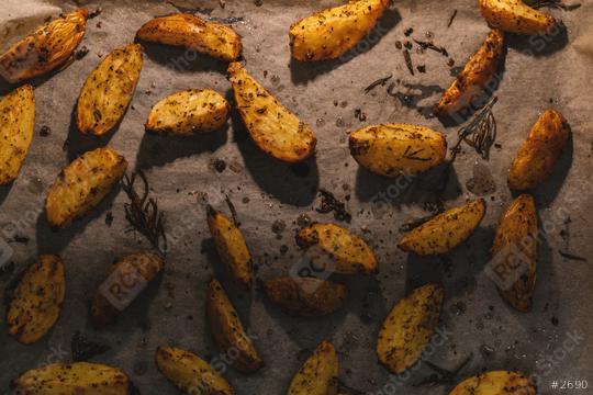 Baked potato wedges with rosemary and oil -  homemade organic vegetable vegan vegetarian potato wedges snack food meal.  : Stock Photo or Stock Video Download rcfotostock photos, images and assets rcfotostock | RC Photo Stock.: