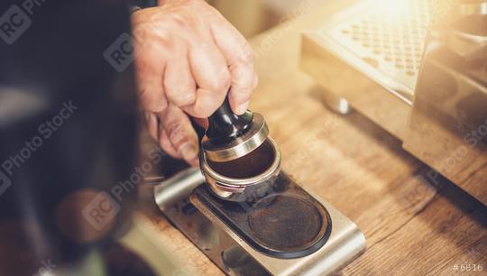 Barista making coffee, pressing temper on portafilter before brewing, at cafe  : Stock Photo or Stock Video Download rcfotostock photos, images and assets rcfotostock | RC Photo Stock.: