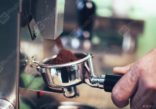 Barista preparing filter holder with coffee flour out of coffee beans mill.  : Stock Photo or Stock Video Download rcfotostock photos, images and assets rcfotostock | RC Photo Stock.: