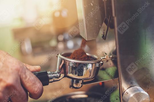 Barista preparing filter holder with coffee flour out of coffee beans mill  : Stock Photo or Stock Video Download rcfotostock photos, images and assets rcfotostock | RC Photo Stock.: