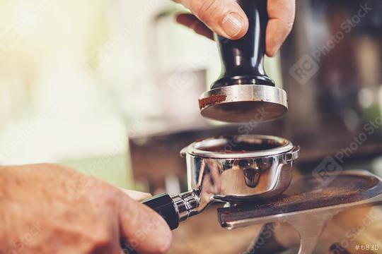 Barista presses ground coffee using tamper  : Stock Photo or Stock Video Download rcfotostock photos, images and assets rcfotostock | RC Photo Stock.: