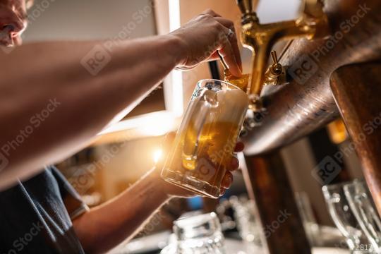 Bartender pouring draft beer in the bar.  : Stock Photo or Stock Video Download rcfotostock photos, images and assets rcfotostock | RC Photo Stock.: