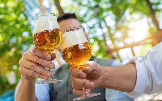 Bavarian friends man clinking beer mugs with traditional Bavarian cuisine in a beer garden or oktoberfest  : Stock Photo or Stock Video Download rcfotostock photos, images and assets rcfotostock | RC Photo Stock.: