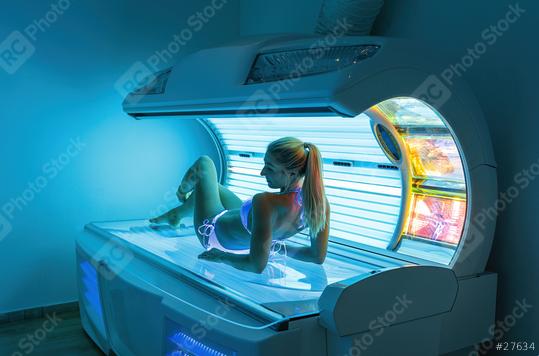 Beautiful and attractive young woman tanning in solarium  : Stock Photo or Stock Video Download rcfotostock photos, images and assets rcfotostock | RC Photo Stock.: