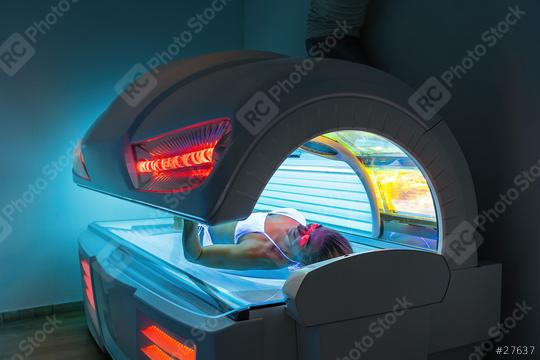 Beautiful and attractive young woman with glasses tanning in solarium  : Stock Photo or Stock Video Download rcfotostock photos, images and assets rcfotostock | RC Photo Stock.: