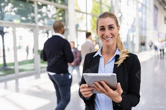 beautiful businesswoman at a trade show  : Stock Photo or Stock Video Download rcfotostock photos, images and assets rcfotostock | RC Photo Stock.: