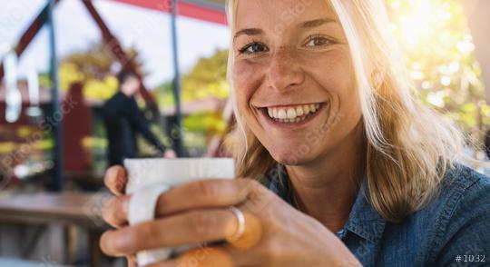 Beautiful smiling woman drinking coffee at cafe. Portrait of mature woman in a cafeteria drinking hot cappuccino and looking at camera. Pretty woman with cup of coffee.  : Stock Photo or Stock Video Download rcfotostock photos, images and assets rcfotostock | RC Photo Stock.: