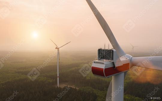 Beautiful sunset above the windmills on a fogy forest lanscape  : Stock Photo or Stock Video Download rcfotostock photos, images and assets rcfotostock | RC Photo Stock.: