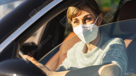 Beautiful woman with a N95 FFP2 anti virus mask sitting in a car, protective mask against coronavirus, driver on a city street during a coronavirus outbreak, covid-19.  : Stock Photo or Stock Video Download rcfotostock photos, images and assets rcfotostock | RC Photo Stock.: