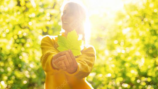 beautiful woman with long blond holding green maple leaf on a sunny day in the Nature  : Stock Photo or Stock Video Download rcfotostock photos, images and assets rcfotostock | RC Photo Stock.: