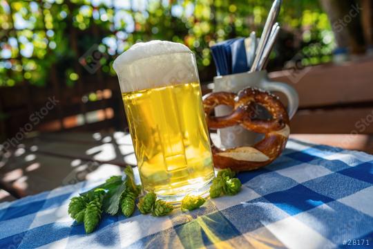 Beer mug with fresh pretzel or brezen and hops at Biergarten or Oktoberfest, Munich, Germany  : Stock Photo or Stock Video Download rcfotostock photos, images and assets rcfotostock | RC Photo Stock.: