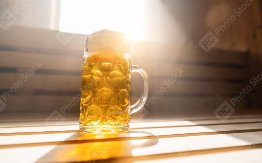 beer mug with frothy beer rest on a ledge in a finnish sauna, catching sunlight. spa and wellness concept image  : Stock Photo or Stock Video Download rcfotostock photos, images and assets rcfotostock | RC Photo Stock.: