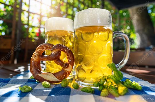 Beer mugs with fresh pretzel or brezen and hops at Oktoberfest, Munich, Germany  : Stock Photo or Stock Video Download rcfotostock photos, images and assets rcfotostock | RC Photo Stock.: