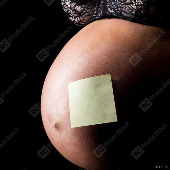 belly of pregnant woman with note   : Stock Photo or Stock Video Download rcfotostock photos, images and assets rcfotostock | RC Photo Stock.: