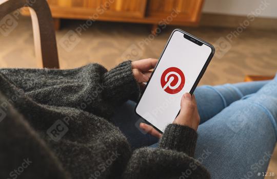 BERLIN, GERMANY AUGUST 2019: Woman hand holding iphone Xs with logo of Pinterest application in a living room. Pinterest is an online pinboard that allows people to pin their interesting things.  : Stock Photo or Stock Video Download rcfotostock photos, images and assets rcfotostock | RC Photo Stock.: