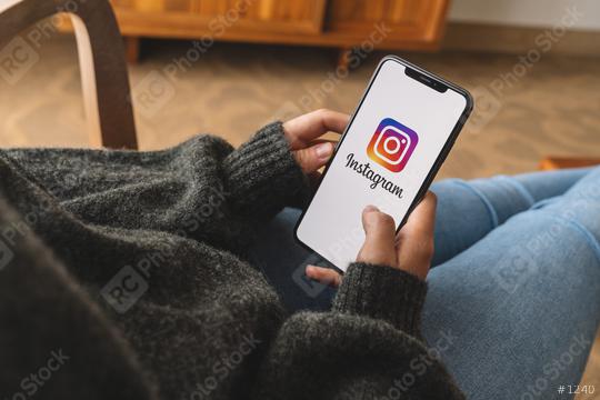 BERLIN, GERMANY AUGUST 2019: Woman hand holding iphone Xs with logo of instagram application. Instagram is largest and most popular photograph social networking.  : Stock Photo or Stock Video Download rcfotostock photos, images and assets rcfotostock | RC Photo Stock.: