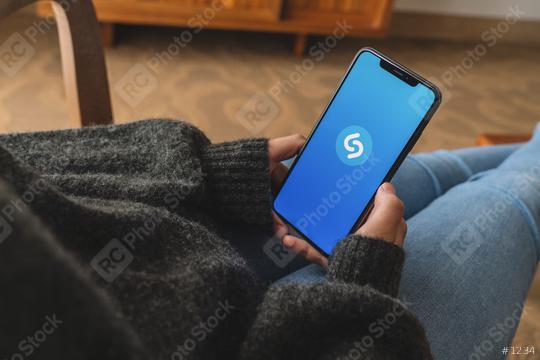 BERLIN, GERMANY AUGUST 2019: Woman Hand Holding Smartphone with Shazam application, Shazam is a service to find music or songs.  : Stock Photo or Stock Video Download rcfotostock photos, images and assets rcfotostock | RC Photo Stock.: