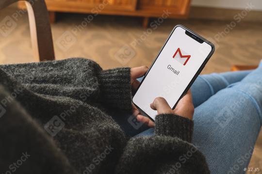 BERLIN, GERMANY AUGUST 2019: Woman holding a iPhone with Google Gmail app logo on the display. Gmail is a most popular free Internet e-mail service provided by Google.  : Stock Photo or Stock Video Download rcfotostock photos, images and assets rcfotostock | RC Photo Stock.: