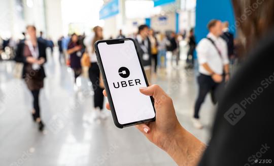 BERLIN, GERMANY JANUARY 2020:  Uber customer holding smartphone in the city to call via app a Uber driver. Uber is an American company offering transportation services online. Illustrative editorial.  : Stock Photo or Stock Video Download rcfotostock photos, images and assets rcfotostock | RC Photo Stock.:
