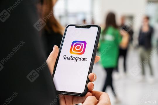 BERLIN, GERMANY JANUARY 2020: Woman hand holding iphone Xs with logo of instagram application in a pedestrian zone. Instagram is largest and most popular photograph social networking.  : Stock Photo or Stock Video Download rcfotostock photos, images and assets rcfotostock | RC-Photo-Stock.:
