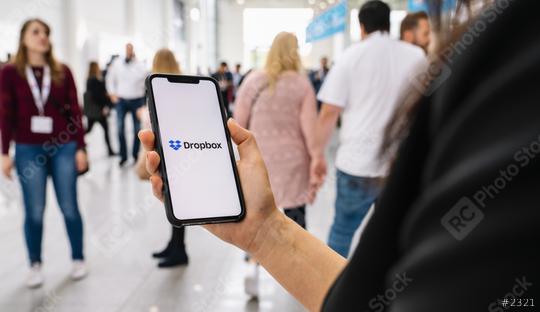 BERLIN, GERMANY JANUARY 2020: Woman hand holding iphone Xs with logo of Dropbox application. Dropbox is a file hosting service operated by Dropbox  : Stock Photo or Stock Video Download rcfotostock photos, images and assets rcfotostock | RC Photo Stock.: