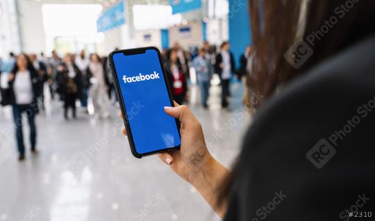 BERLIN, GERMANY JANUARY 2020: Woman hand holding iphone Xs with logo of Facebook application in a pedestrian zone. Facebook is an online social networking service founded February 2004 Mark Zuckerberg  : Stock Photo or Stock Video Download rcfotostock photos, images and assets rcfotostock | RC Photo Stock.: