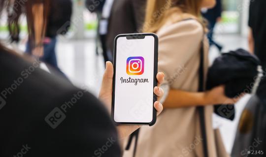 BERLIN, GERMANY JANUARY 2020: Woman hand holding iphone Xs with logo of instagram application in a pedestrian zone. Instagram is largest and most popular photograph social networking.  : Stock Photo or Stock Video Download rcfotostock photos, images and assets rcfotostock | RC Photo Stock.: