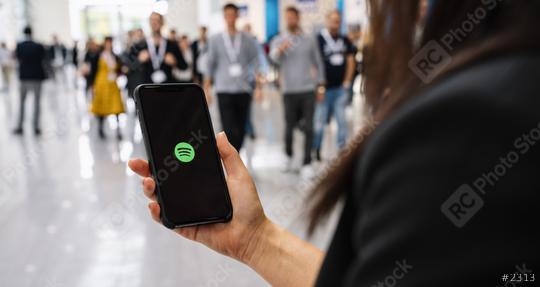 BERLIN, GERMANY JANUARY 2020: Woman holding a iPhone Xs opening spotify app, Spotify is a music service that offers legal streaming music.  : Stock Photo or Stock Video Download rcfotostock photos, images and assets rcfotostock | RC Photo Stock.: