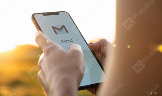 BERLIN, GERMANY JULY 2019: Business woman holding a iPhone with Google Gmail app logo on the display. Gmail is a most popular free Internet e-mail service provided by Google.  : Stock Photo or Stock Video Download rcfotostock photos, images and assets rcfotostock | RC Photo Stock.: