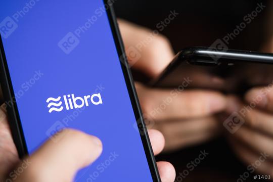 BERLIN, GERMANY JULY 2019: Libra Facebook cryptocurrency and bitcoin cryptocurrency smartphone share, Libra coins concept.  : Stock Photo or Stock Video Download rcfotostock photos, images and assets rcfotostock | RC-Photo-Stock.: