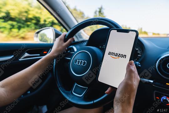 BERLIN, GERMANY JULY 2019: Woman hand holding iphone Xs Amazon logo on screen in a car. Amazon.com, Inc. American international electronic commerce company.  : Stock Photo or Stock Video Download rcfotostock photos, images and assets rcfotostock | RC Photo Stock.: