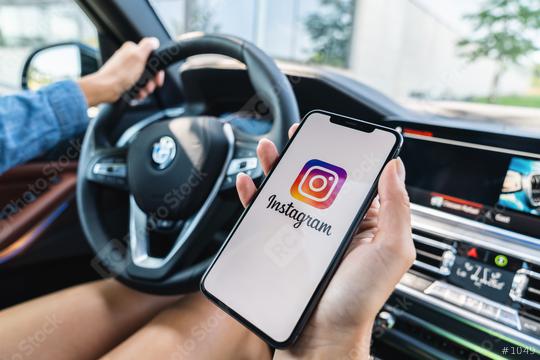 BERLIN, GERMANY JULY 2019: Woman hand holding iphone Xs with logo of instagram application in a car. Instagram is largest and most popular photograph social networking.  : Stock Photo or Stock Video Download rcfotostock photos, images and assets rcfotostock | RC Photo Stock.: