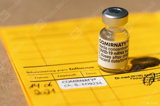 BERLIN, GERMANY JUNE 2021: Certificate of vaccination with Pfizer–BioNTech COVID-19 vaccine comirnaty and sticker in an international who vaccination certificate.    : Stock Photo or Stock Video Download rcfotostock photos, images and assets rcfotostock | RC Photo Stock.:
