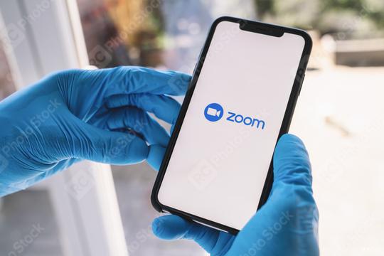 BERLIN, GERMANY MAR 2020: Man with gloves opening the Zoom mobile app on her smartphone. Zoom users can opt to record sessions, collaborate on projects, and share or annotate on one another  : Stock Photo or Stock Video Download rcfotostock photos, images and assets rcfotostock | RC Photo Stock.: