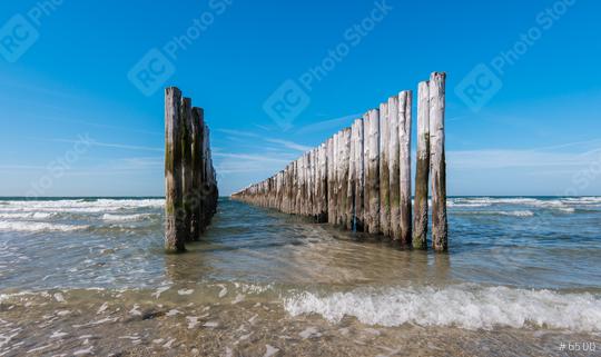 Between the two rows of poles of the breakwater against clear blue sky  : Stock Photo or Stock Video Download rcfotostock photos, images and assets rcfotostock | RC Photo Stock.: