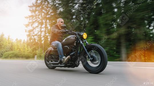 Biker riding motorcycle chopper on an empty road at sunny day  : Stock Photo or Stock Video Download rcfotostock photos, images and assets rcfotostock | RC Photo Stock.: