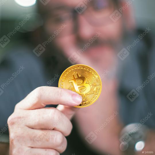 Bitcoin in hand of a businessman  : Stock Photo or Stock Video Download rcfotostock photos, images and assets rcfotostock | RC Photo Stock.: