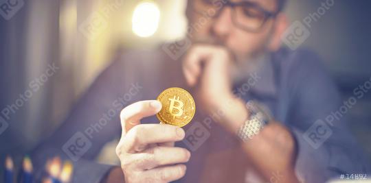 Bitcoin in hand of a businessman  : Stock Photo or Stock Video Download rcfotostock photos, images and assets rcfotostock | RC Photo Stock.: