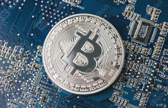 Bitcoin on a computer chip on motherboard  : Stock Photo or Stock Video Download rcfotostock photos, images and assets rcfotostock | RC Photo Stock.:
