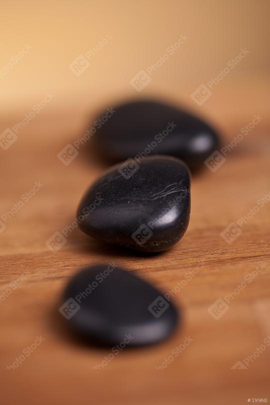 black stones on wood background  : Stock Photo or Stock Video Download rcfotostock photos, images and assets rcfotostock | RC Photo Stock.: