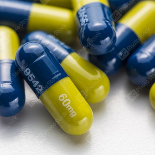 Blue yellow capsules therapy pills flu doctor antibiotic pharmacy medicine medical  : Stock Photo or Stock Video Download rcfotostock photos, images and assets rcfotostock | RC Photo Stock.: