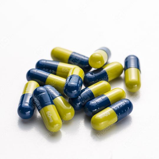 Blue yellow heap capsules therapy pills flu doctor antibiotic pharmacy medicine medical Stock