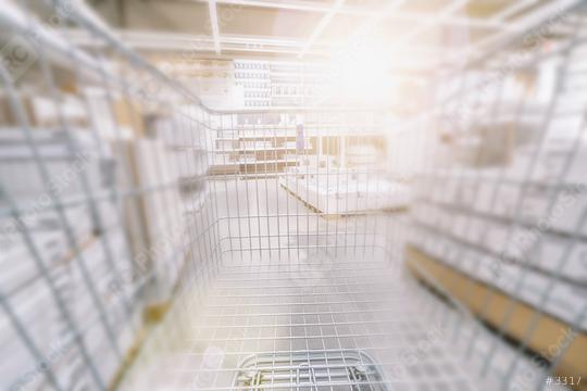 Blurred  Supermarket with empty shopping cart  : Stock Photo or Stock Video Download rcfotostock photos, images and assets rcfotostock | RC Photo Stock.: