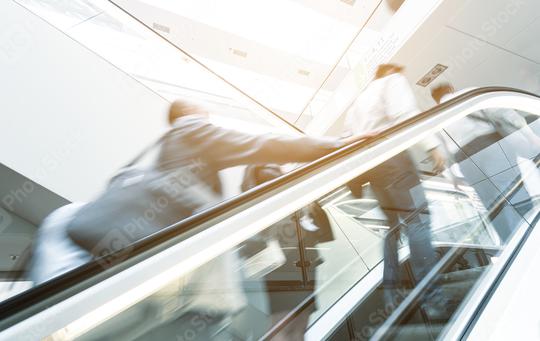 Blurred business people at a escalator  : Stock Photo or Stock Video Download rcfotostock photos, images and assets rcfotostock | RC Photo Stock.: