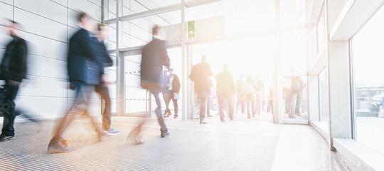 Blurred business people at a trade fair entrance  : Stock Photo or Stock Video Download rcfotostock photos, images and assets rcfotostock | RC-Photo-Stock.: