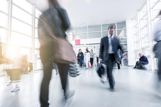 Blurred business people at a trade fair entrance  : Stock Photo or Stock Video Download rcfotostock photos, images and assets rcfotostock | RC Photo Stock.: